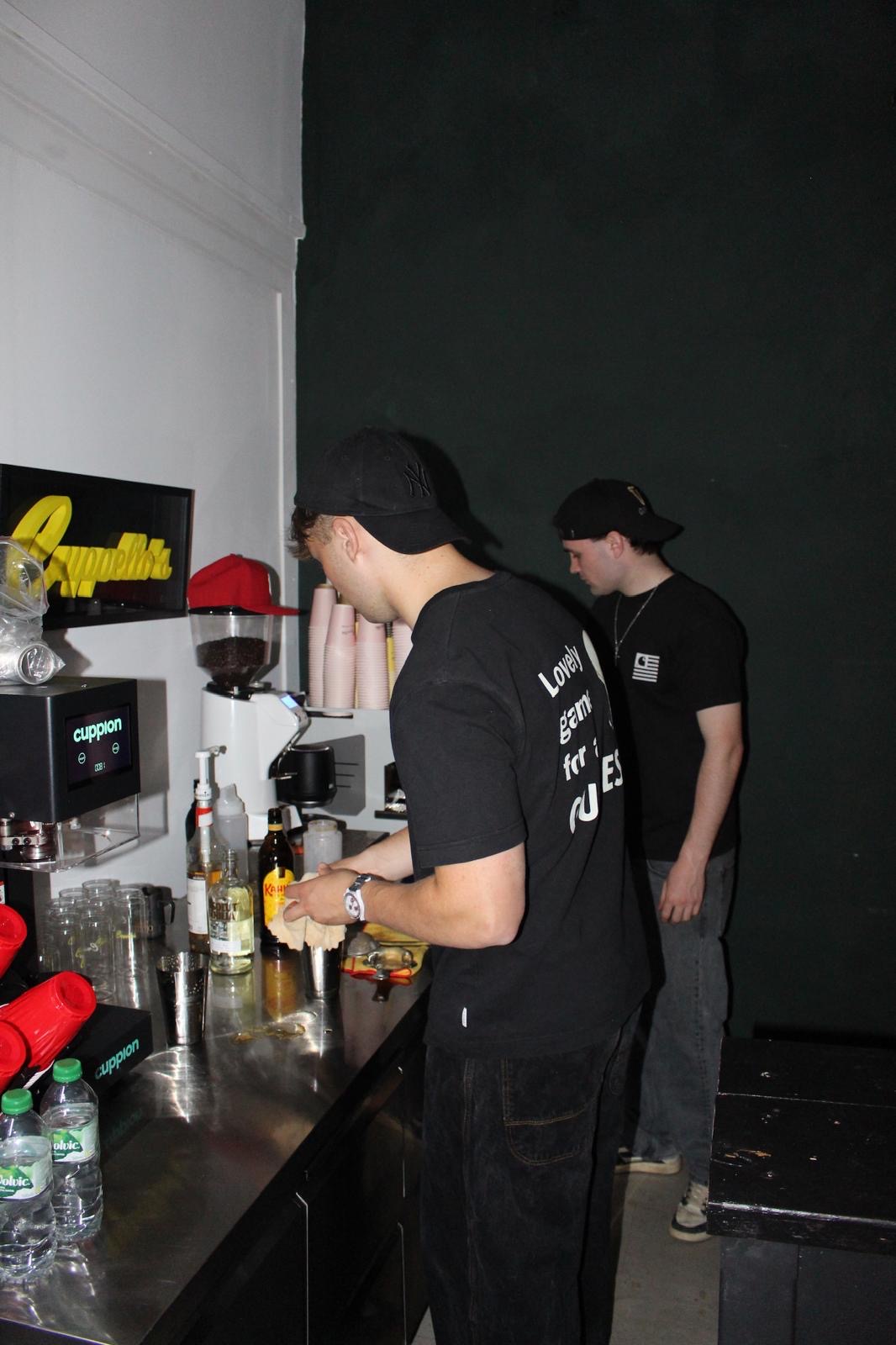 Two GetBarred team members working the bar during the Cuppellos event