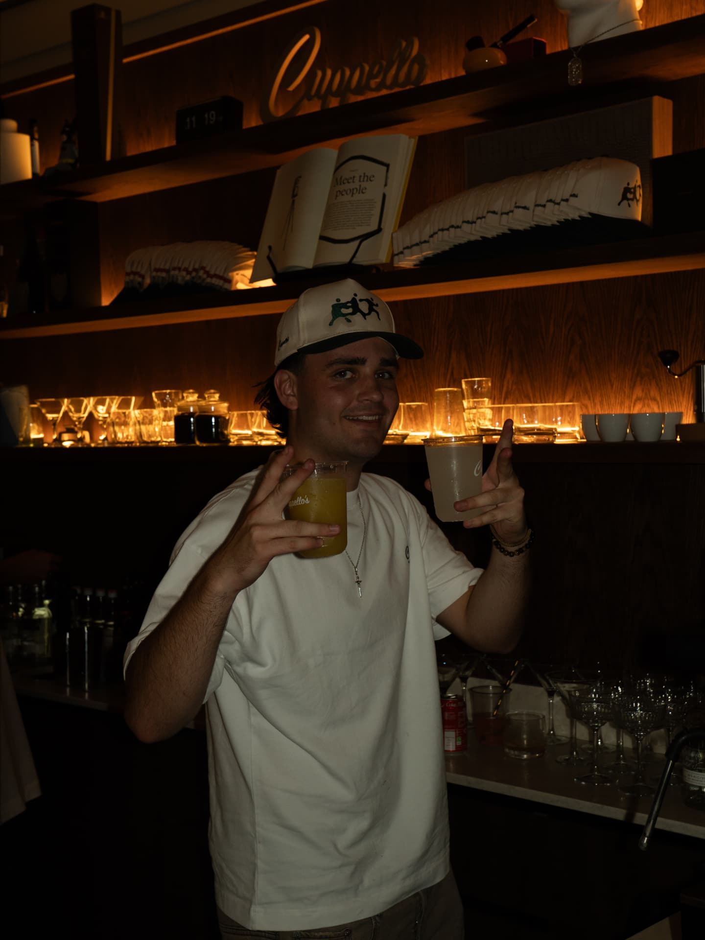Cuppellos — Bartender serving drinks